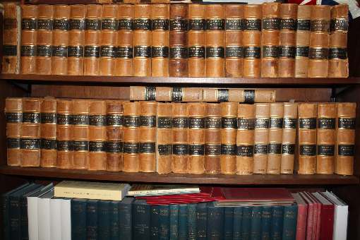 upper shelf Complete Works of H. H. Bancroft, <br> lower shelf volumes of the Selden Society